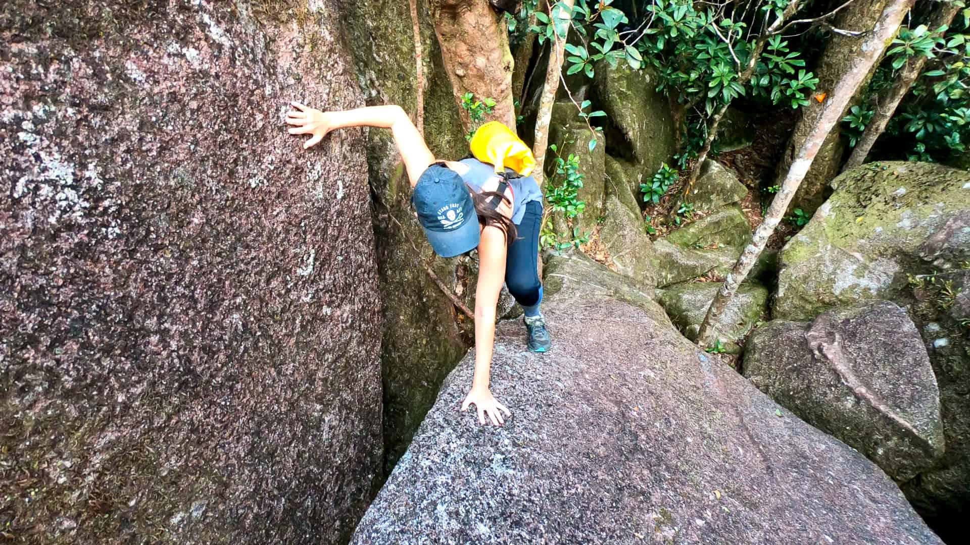 Climbing over boulders along the Western Trail at Mount Bartle Frere, Queensland, Australia // Travel Mermaid