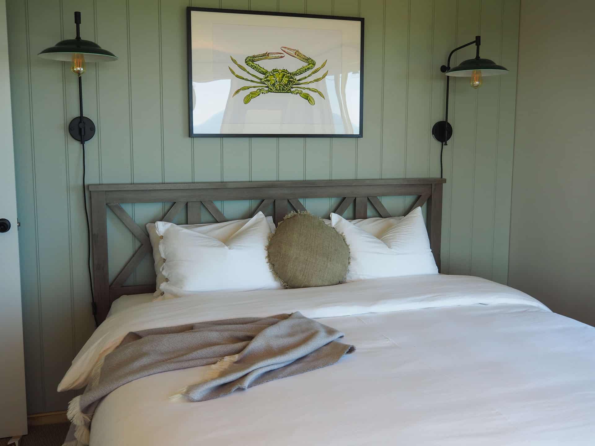 King sized bed in the master bedroom at The Glass House WA Airbnb in Greenough, Western Australia