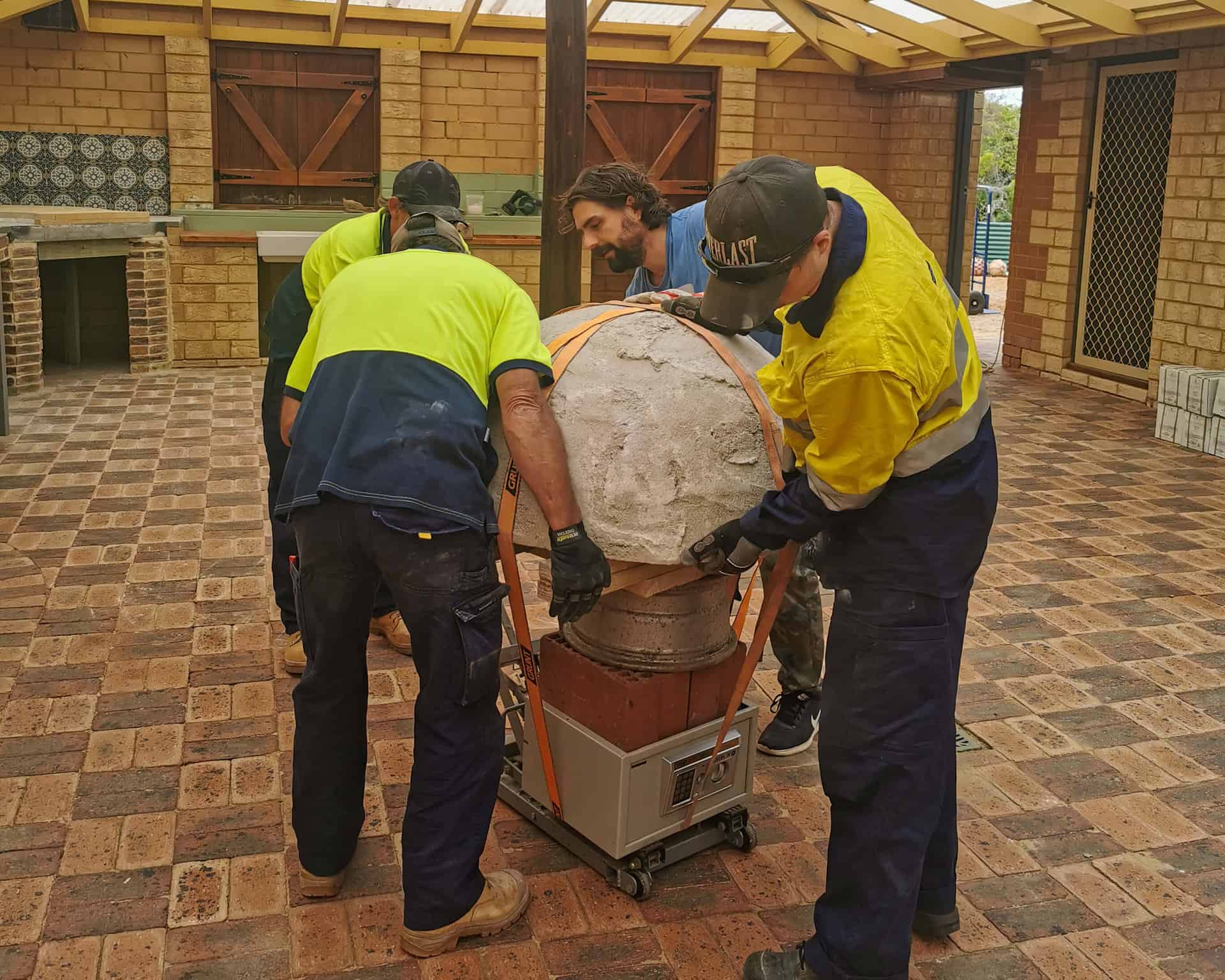 Wheeling in the pizza oven at The Glass House in Greenough, Western Australia