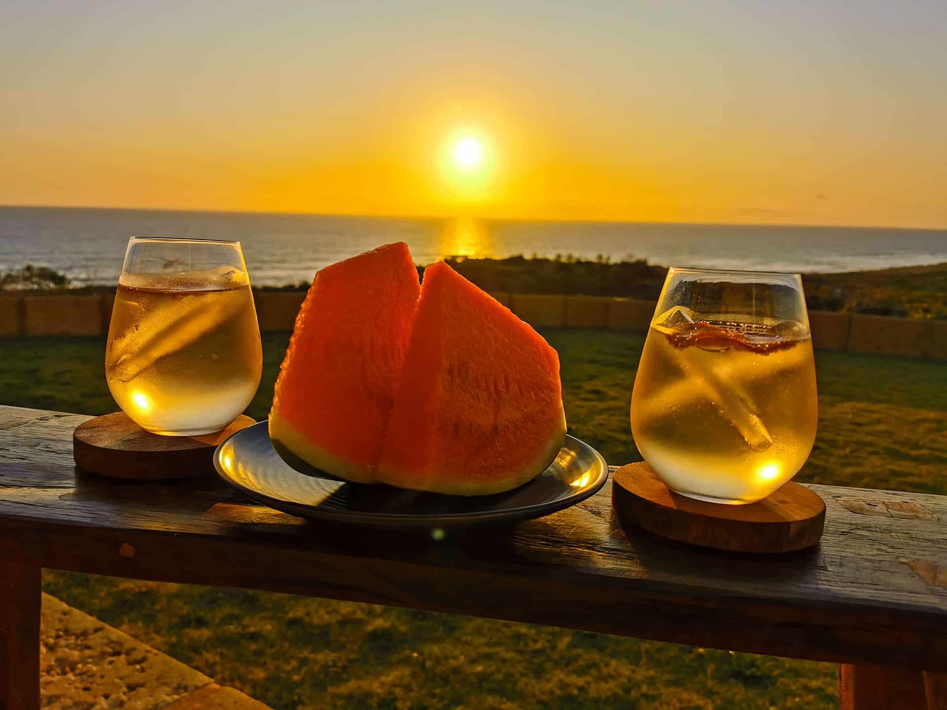 Sunset drinks and watermelon at The Glass House WA Airbnb in Greenough, Western Australia